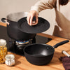 Stainelss steel universal lids on nonstick stockpot and saucier