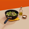 Black accent nonstick saucier with oil and seasonings