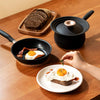 Breakfast made by accent cookware set and univeral lid