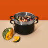 stainelss steel steamer insert with food on top of stockpot